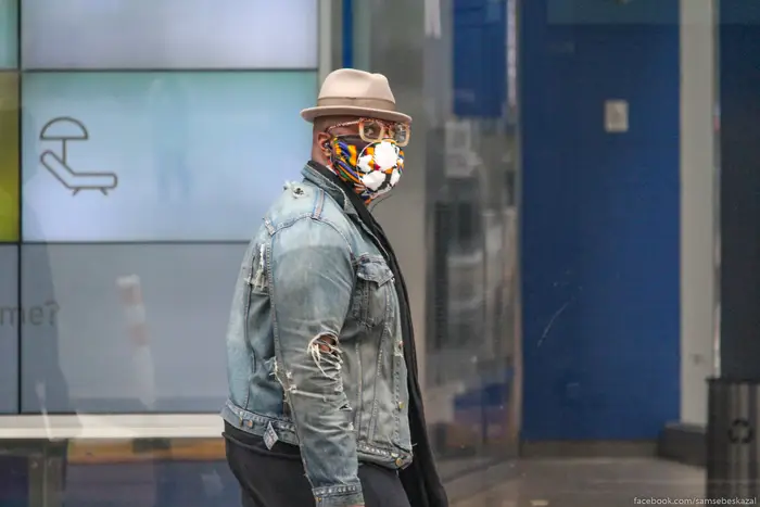 A photo of a man wearing a face mask